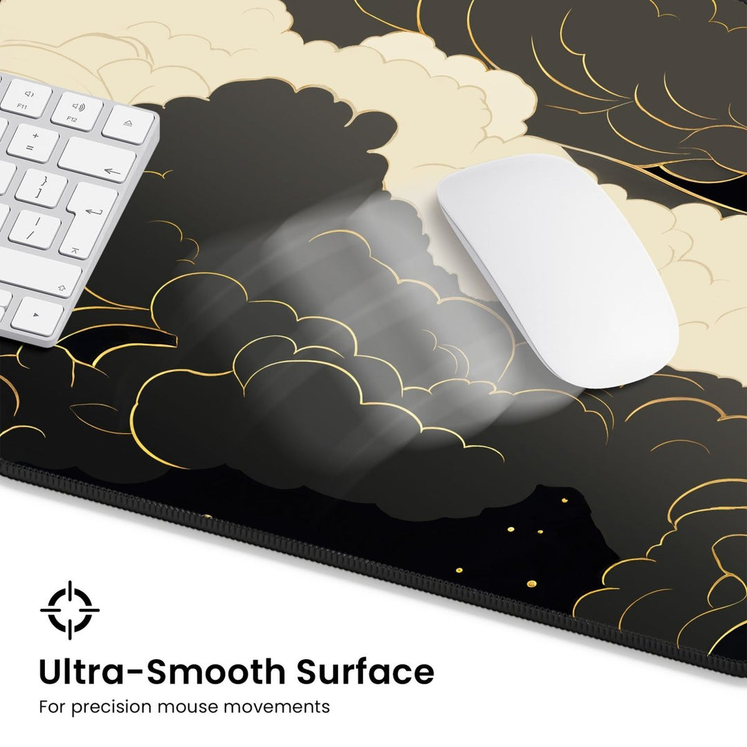 Home Decor - A white keyboard and mouse sit atop the Dark Cloud Desk Mat – Celestial Gaming Mouse Pad, featuring a black and gold cloud pattern. The text at the bottom states, "Ultra - Smooth Surface for precision mouse movements," ideal for an elegant gaming desk setup. - Kaladyn Designs