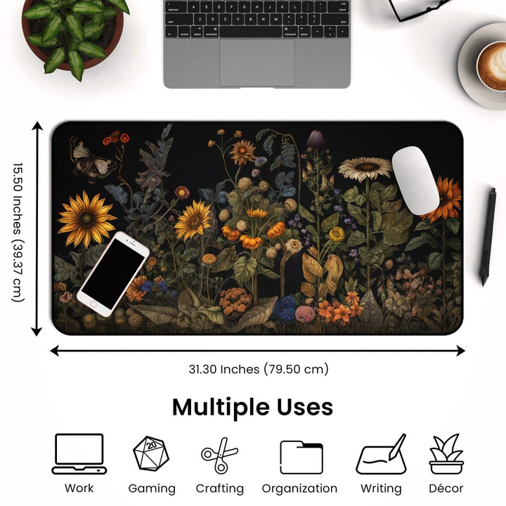 Home Decor - The Botanical Desk Mat – Vintage Floral Design Large Mouse Pad for Office & Gaming, measuring 31.30 inches by 15.50 inches, is placed on a wooden surface with a phone, mouse, and keyboard on it. Icons below highlight its versatility for work, gaming, crafting, organization, writing, and decor. The top part of a laptop is visible as well. - Kaladyn Designs