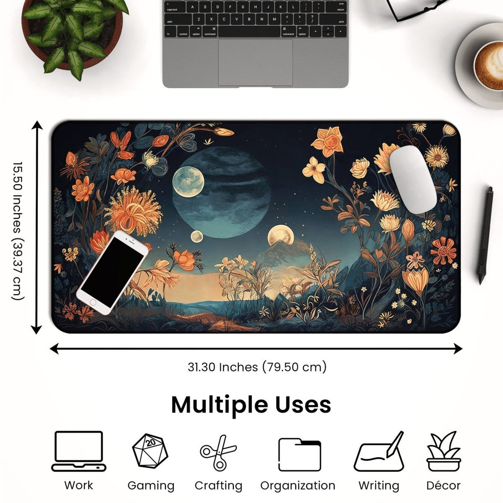 Home Decor - A Celestial Floral Desk Mat – Large Moon - Themed Mouse Pad for Office or Gaming is placed on a desk, creating a spacious workspace with its dimensions of 31.30 x 15.50 inches. Adorned with floral and planetary designs, this large, rectangular mat complements nearby items like a laptop, a coffee cup, a plant, and a mouse. Icons below highlight its versatility for work, gaming, crafting, organization, writing, and décor purposes. - Kaladyn Designs