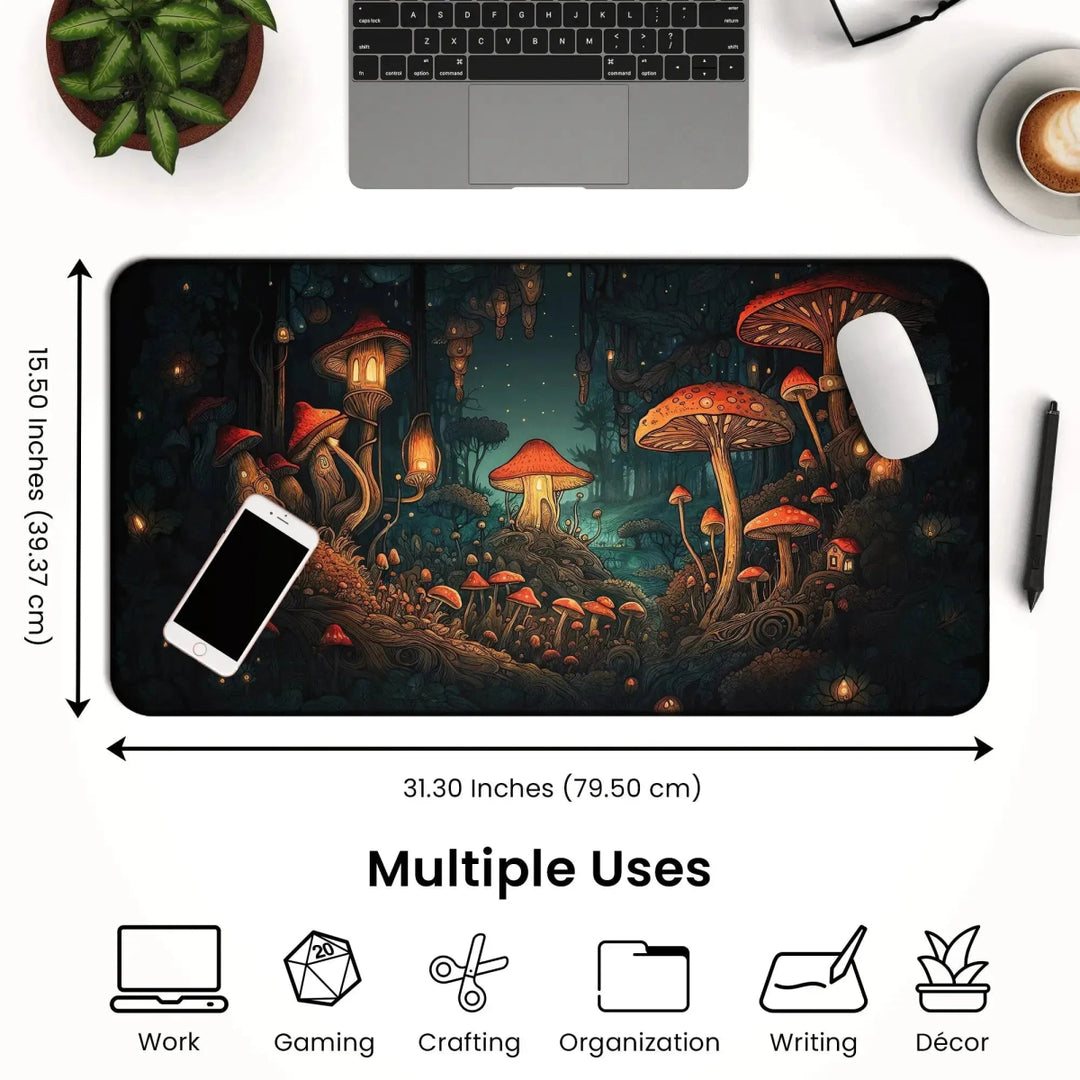 A dark cottagecore desk setup features a laptop, a cup of coffee, and a plant. In the center lies a large Mushroom Forest Desk Mat – Dark Cottagecore Witchy Gaming Mouse Pad & Tarot Mat (31.30 x 15.50 inches) with a detailed illustration of a fantastical mushroom forest. Icons show its uses for work, gaming, crafting, writing, organization, and décor.