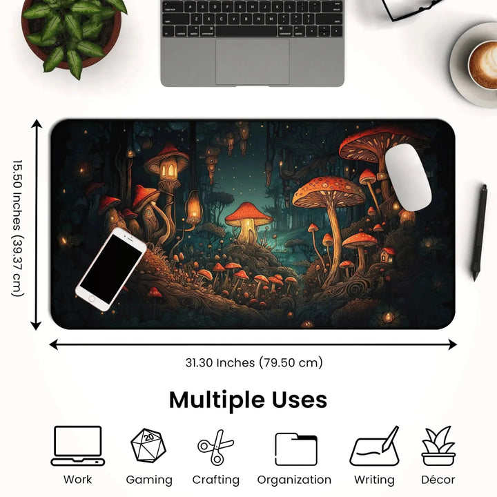 A dark cottagecore desk setup features a laptop, a cup of coffee, and a plant. In the center lies a large Mushroom Forest Desk Mat – Dark Cottagecore Witchy Gaming Mouse Pad & Tarot Mat (31.30 x 15.50 inches) with a detailed illustration of a fantastical mushroom forest. Icons show its uses for work, gaming, crafting, writing, organization, and décor.